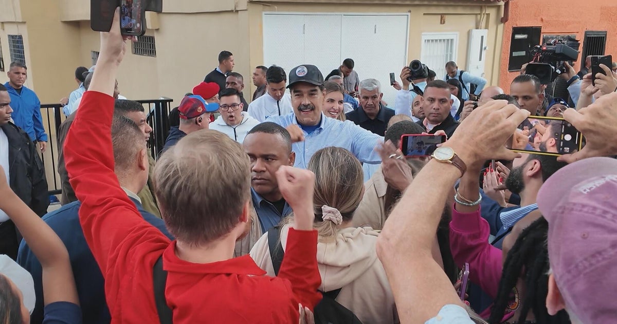 Ambassador James Story with 60 Minutes correspondent Sharyn Alfonsi in Caracas, Venezuela — CBS News